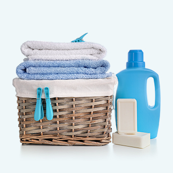 laundry supplies with folded laundry in a basket